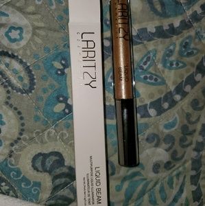 Laritzy-liquid beam multi purpose illuminator.